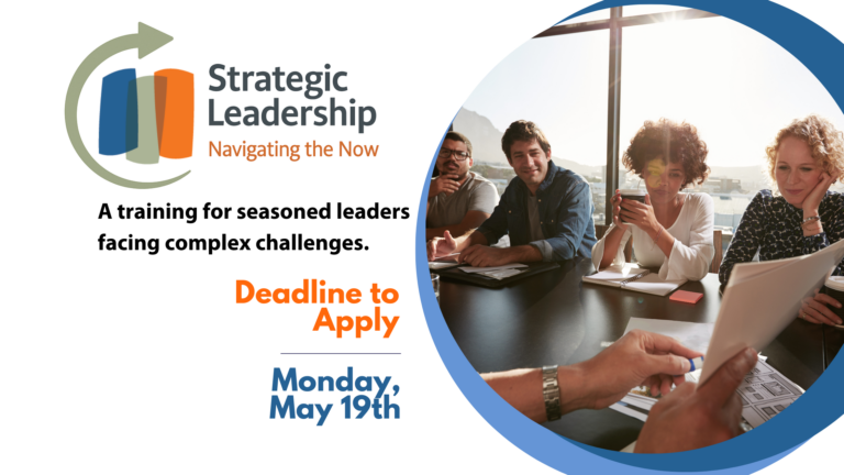 Leaders sitting at a table strategizing